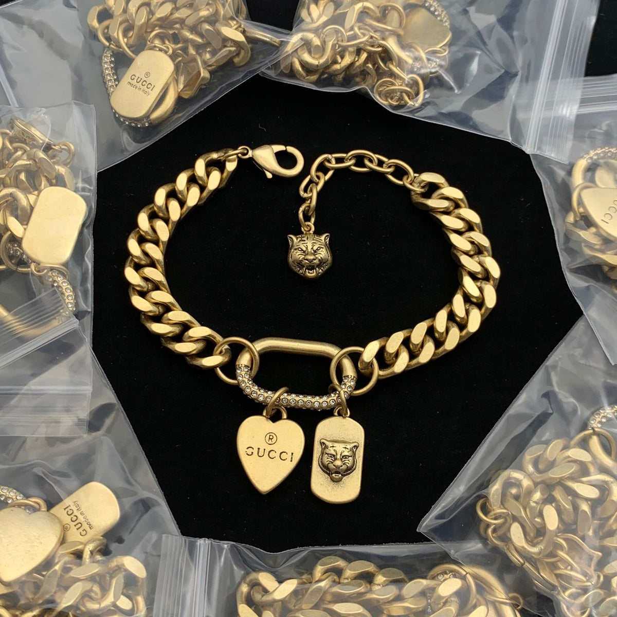 Bold Gold-Tone Curb Chain Bracelet with Tiger Head & Heart Charms