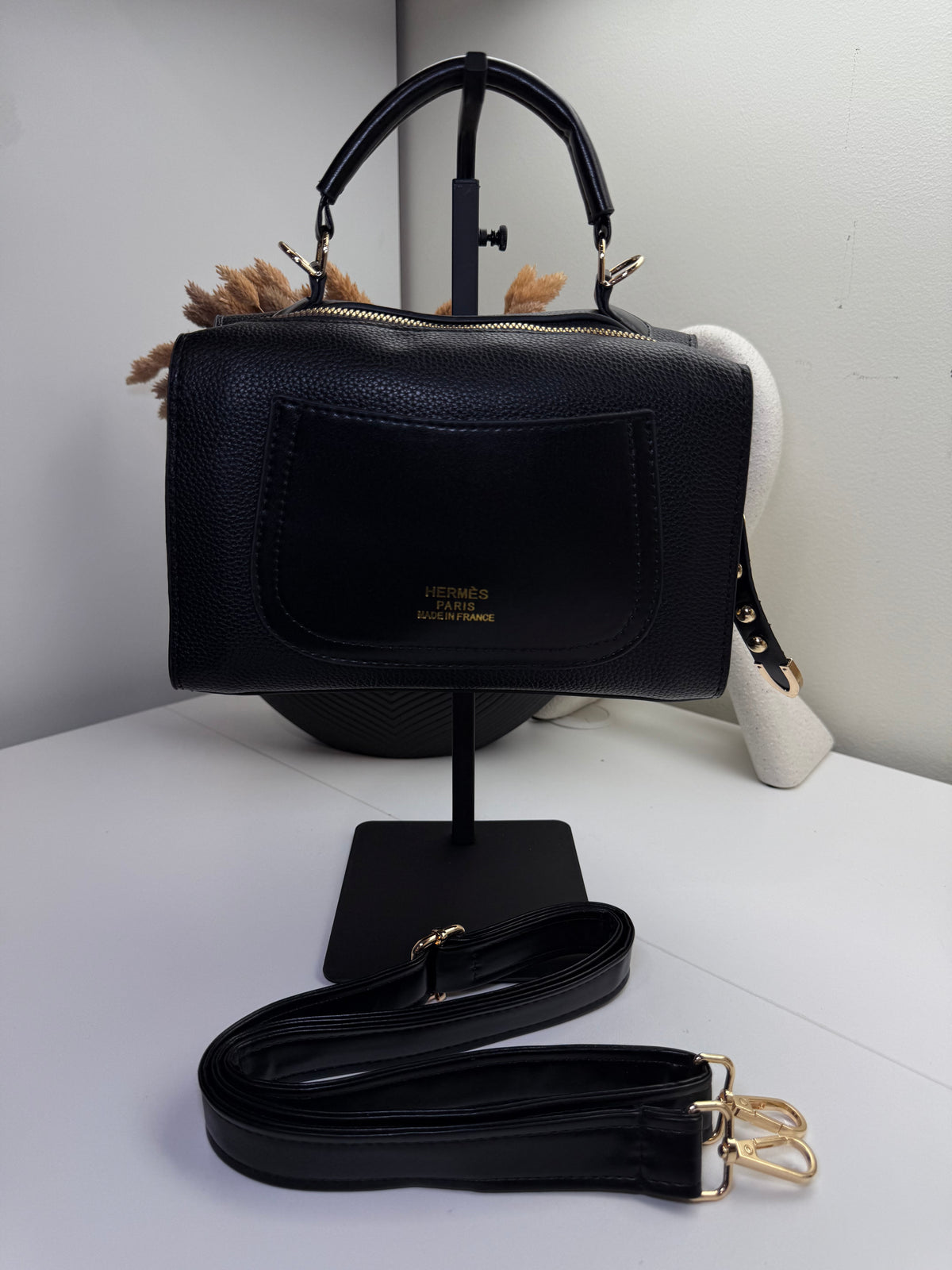 Chic Black Handbag with Gold Accents