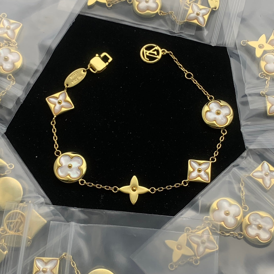Classic Gold Chain Bracelet with Icon Motif Charms and Toggle Clasp